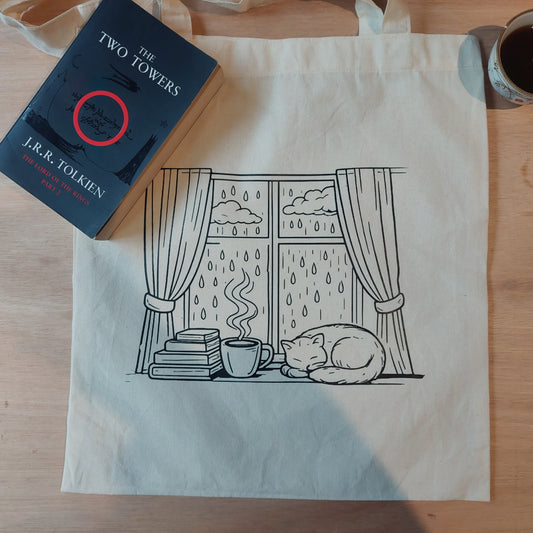 Tote gatito y lluvia